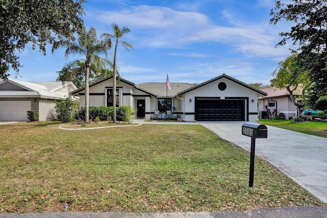 3985 NW 73rd Way, Coral Springs, FL 33065 - ranch-style home featuring driveway, a garage, a front yard, and stucco siding
