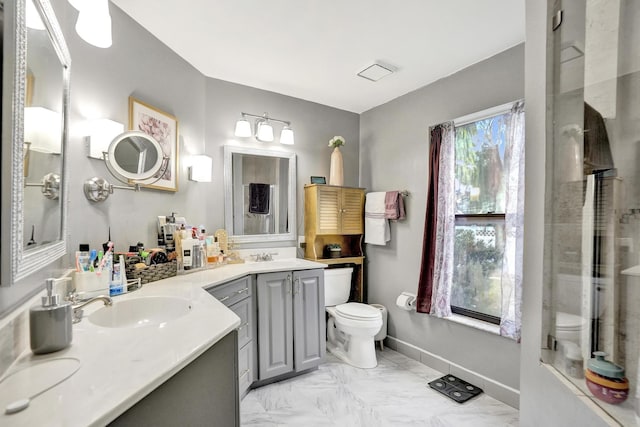 3985 NW 73rd Way, Coral Springs, FL 33065 - full bathroom with toilet, double vanity, marble look tiles, and a shower with door