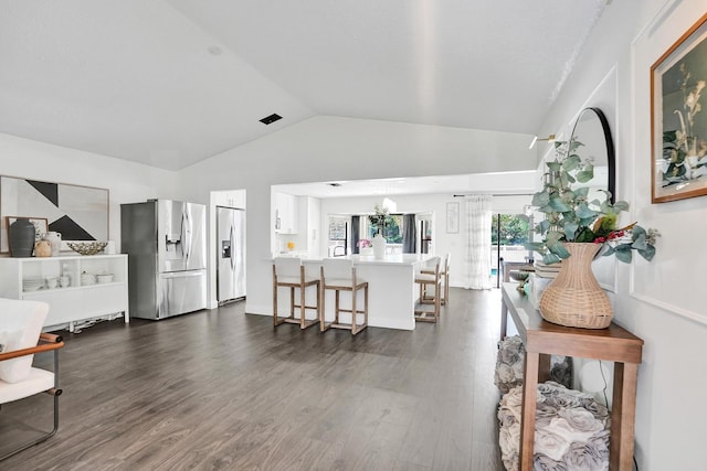 3985 NW 73rd Way, Coral Springs, FL 33065 - living room with vaulted ceiling, dark wood-style flooring, and a chandelier
