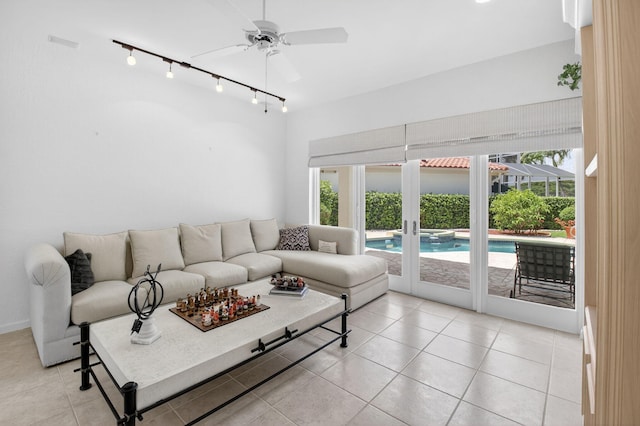 2373 NW 25th Way, Boca Raton, FL 33434 - living area with rail lighting, healthy amount of natural light, light tile patterned flooring, and ceiling fan