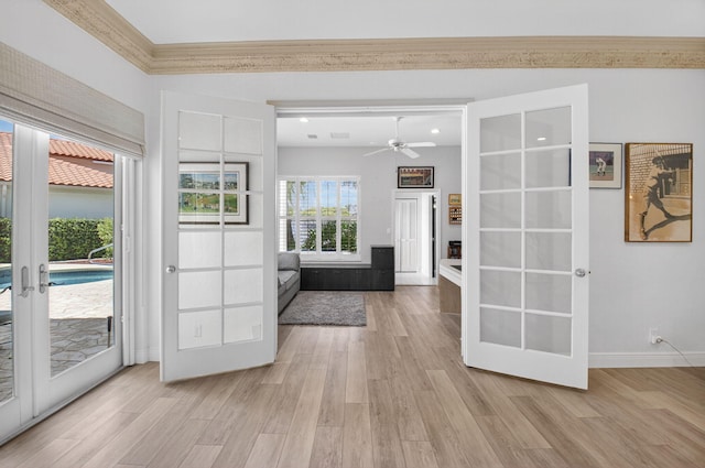 2373 NW 25th Way, Boca Raton, FL 33434 - entryway with french doors, light wood-style flooring, a ceiling fan, and ornamental molding