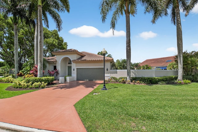 2373 NW 25th Way, Boca Raton, FL 33434 - mediterranean / spanish house featuring a tiled roof, stucco siding, an attached garage, and concrete driveway