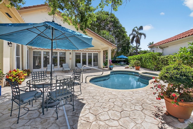 2373 NW 25th Way, Boca Raton, FL 33434 - view of pool with a patio area and a pool with connected hot tub