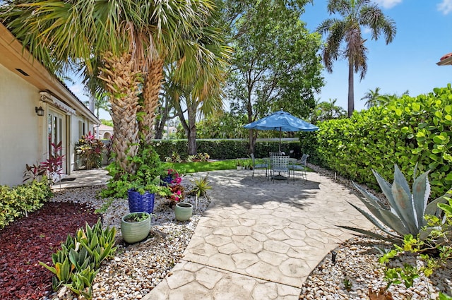 2373 NW 25th Way, Boca Raton, FL 33434 - fenced backyard featuring a patio area and outdoor dining area