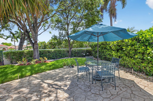 2373 NW 25th Way, Boca Raton, FL 33434 - fenced backyard with a patio area and outdoor dining area