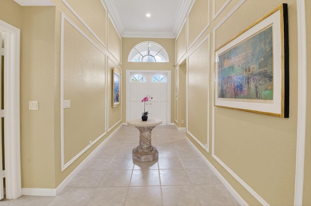 2373 NW 25th Way, Boca Raton, FL 33434 - entryway featuring crown molding, a decorative wall, and light tile patterned floors