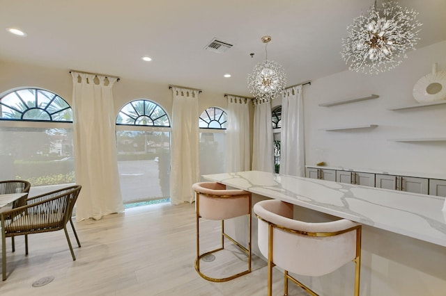 2373 NW 25th Way, Boca Raton, FL 33434 - dining room featuring recessed lighting, light wood-type flooring, and a chandelier