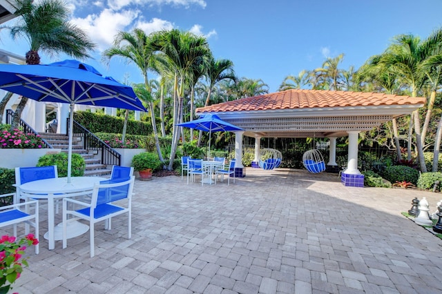 2373 NW 25th Way, Boca Raton, FL 33434 - view of patio with outdoor dining space, stairs, and a gazebo