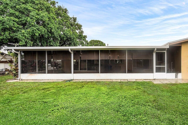 8330 NW 23rd St, Pembroke Pines, FL 33024 - back of property with a sunroom and a yard