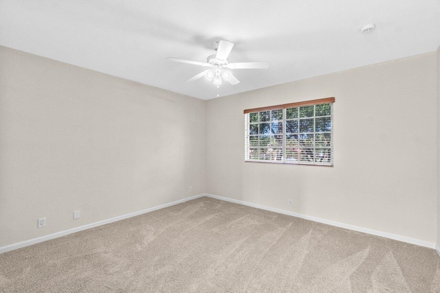 7359 Briella Dr, Boynton Beach, FL 33437 - unfurnished room with light carpet, baseboards, ceiling fan, and a smoke detector