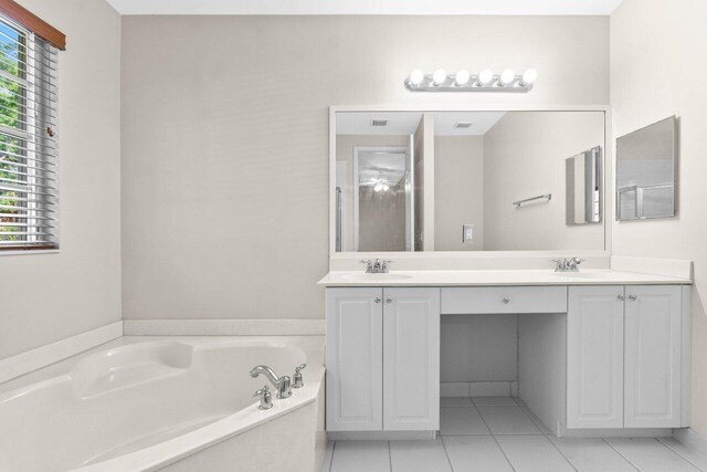 7359 Briella Dr, Boynton Beach, FL 33437 - full bath featuring double vanity, plenty of natural light, a bath, and tile patterned floors