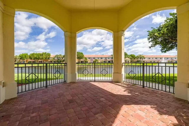 7359 Briella Dr, Boynton Beach, FL 33437 - view of patio with a water view and a residential view