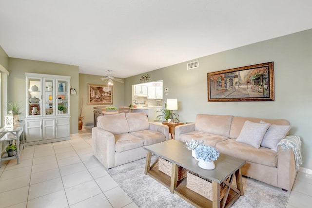 338 Pine Ridge Cir Unit B-1, Greenacres, FL 33463 - living area featuring light tile patterned floors, ceiling fan, and baseboards