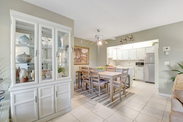 338 Pine Ridge Cir Unit B-1, Greenacres, FL 33463 - dining space with ceiling fan, light tile patterned floors, and baseboards