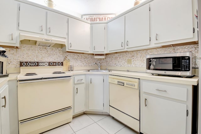 338 Pine Ridge Cir Unit B-1, Greenacres, FL 33463 - kitchen featuring white appliances, under cabinet range hood, a sink, light countertops, and light tile patterned floors