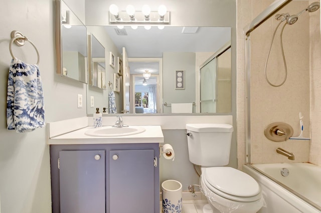 338 Pine Ridge Cir Unit B-1, Greenacres, FL 33463 - full bath featuring toilet, vanity, bath / shower combo with glass door, ceiling fan, and tile patterned floors