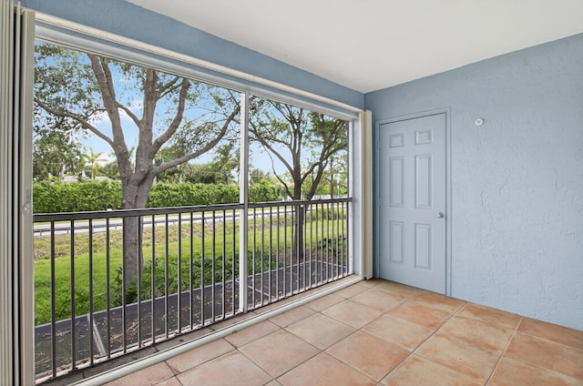 3131 Clint Moore Rd Unit 206, Boca Raton, FL 33496 - unfurnished room featuring a textured wall and tile patterned flooring