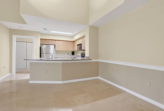 3131 Clint Moore Rd Unit 206, Boca Raton, FL 33496 - kitchen featuring freestanding refrigerator, a peninsula, electric range oven, baseboards, and light stone counters