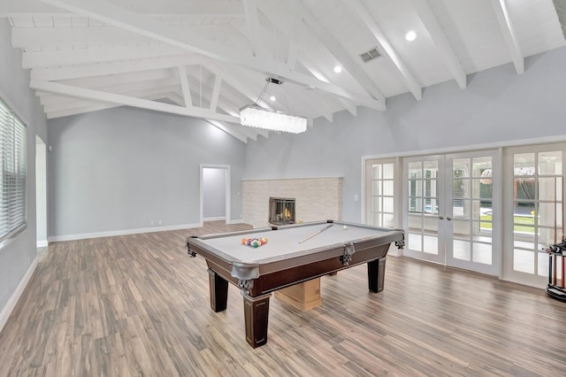 1220 N Swinton Ave, Delray Beach, FL 33444 - playroom with french doors, beam ceiling, wood finished floors, baseboards, and plenty of natural light