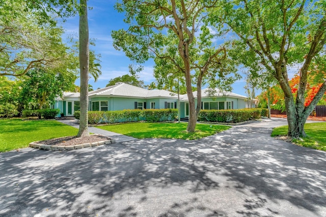1220 N Swinton Ave, Delray Beach, FL 33444 - single story home with a front lawn