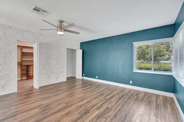 1220 N Swinton Ave, Delray Beach, FL 33444 - unfurnished bedroom with wood finished floors, baseboards, and a ceiling fan