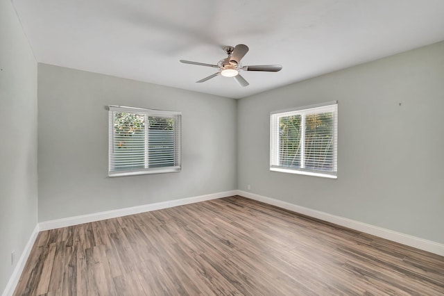 1220 N Swinton Ave, Delray Beach, FL 33444 - spare room featuring wood finished floors, baseboards, and a ceiling fan