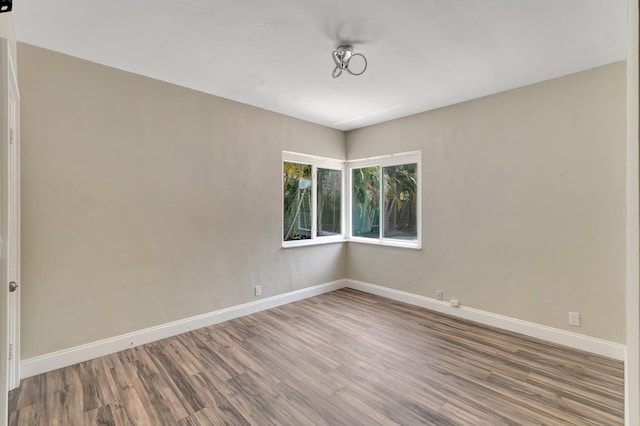 1220 N Swinton Ave, Delray Beach, FL 33444 - empty room featuring wood finished floors and baseboards