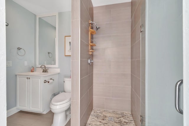 1220 N Swinton Ave, Delray Beach, FL 33444 - full bath with a stall shower, toilet, vanity, and tile patterned flooring