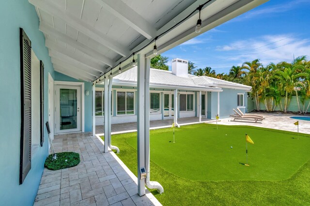 1220 N Swinton Ave, Delray Beach, FL 33444 - view of patio with an area to practice putting