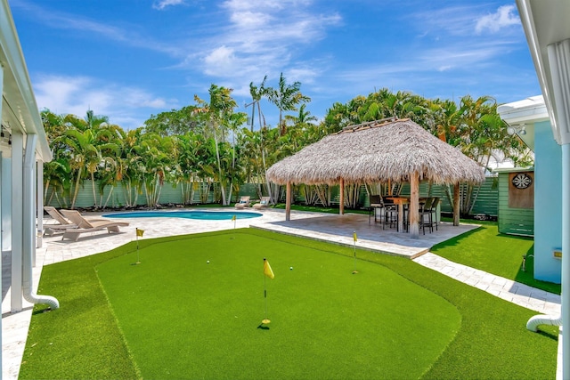 1220 N Swinton Ave, Delray Beach, FL 33444 - surrounding community featuring a putting green, a patio area, a gazebo, and a pool