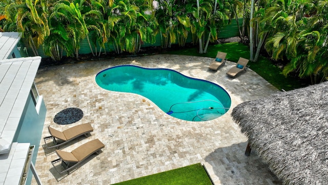 1220 N Swinton Ave, Delray Beach, FL 33444 - outdoor pool with a patio and a fenced backyard