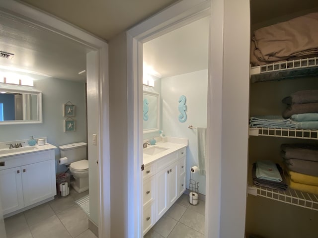 302 Pine Ridge Cir Unit D-1, Greenacres, FL 33463 - bathroom with tile patterned flooring, toilet, and vanity
