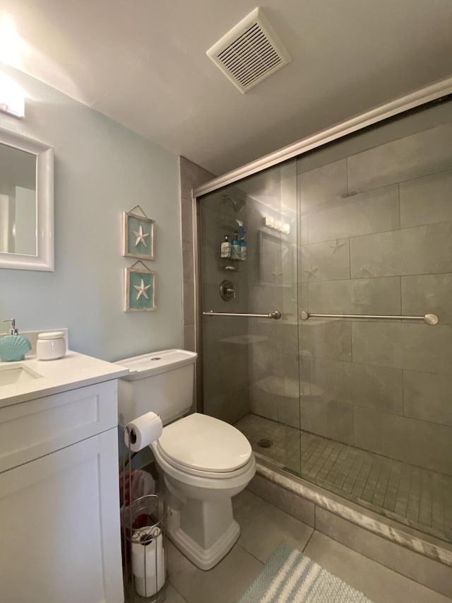 302 Pine Ridge Cir Unit D-1, Greenacres, FL 33463 - bathroom featuring a stall shower, vanity, tile patterned floors, and toilet