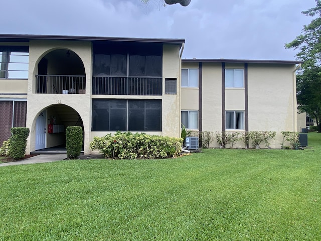 302 Pine Ridge Cir Unit D-1, Greenacres, FL 33463 - view of building exterior featuring central air condition unit