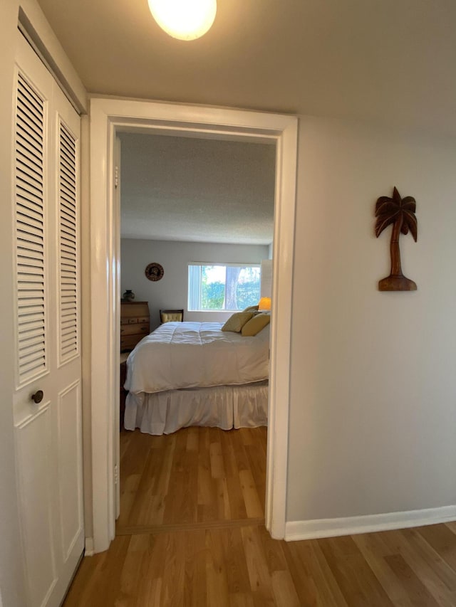 302 Pine Ridge Cir Unit D-1, Greenacres, FL 33463 - bedroom featuring light wood finished floors and baseboards