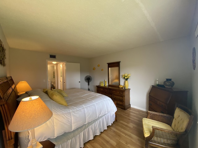 302 Pine Ridge Cir Unit D-1, Greenacres, FL 33463 - bedroom with light wood-style floors and baseboards