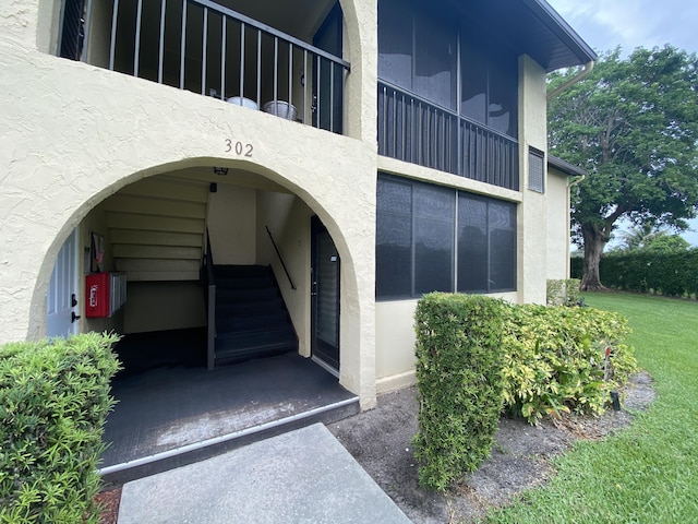 302 Pine Ridge Cir Unit D-1, Greenacres, FL 33463 - entrance to property featuring stucco siding