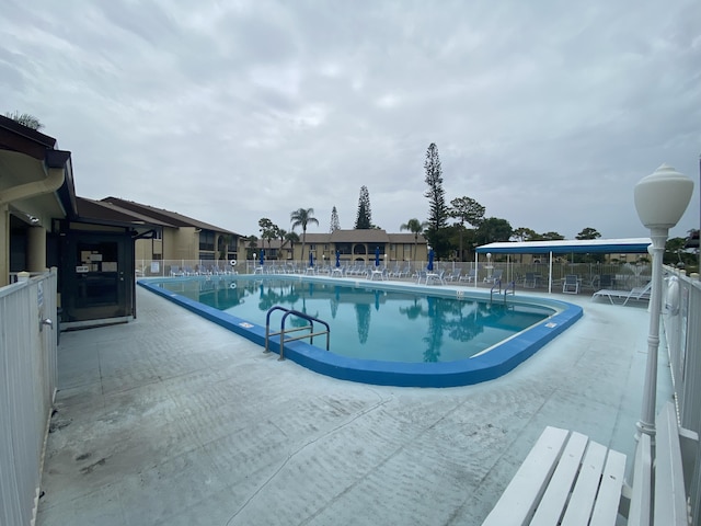 302 Pine Ridge Cir Unit D-1, Greenacres, FL 33463 - community pool featuring a patio