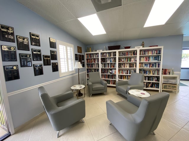 302 Pine Ridge Cir Unit D-1, Greenacres, FL 33463 - living area featuring a paneled ceiling and tile patterned flooring