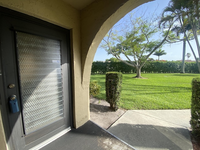 302 Pine Ridge Cir Unit D-1, Greenacres, FL 33463 - entrance to property with a yard