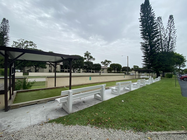 302 Pine Ridge Cir Unit D-1, Greenacres, FL 33463 - surrounding community featuring a yard and a game area