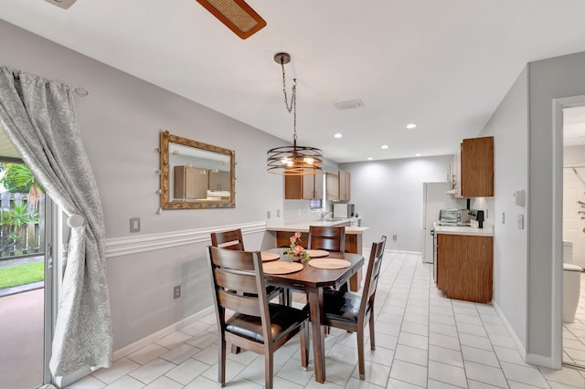 3928 Coelebs Ave, Boynton Beach, FL 33436 - dining space with light tile patterned floors, baseboards, and recessed lighting