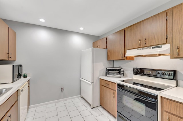 3928 Coelebs Ave, Boynton Beach, FL 33436 - kitchen with white appliances, under cabinet range hood, light countertops, baseboards, and recessed lighting