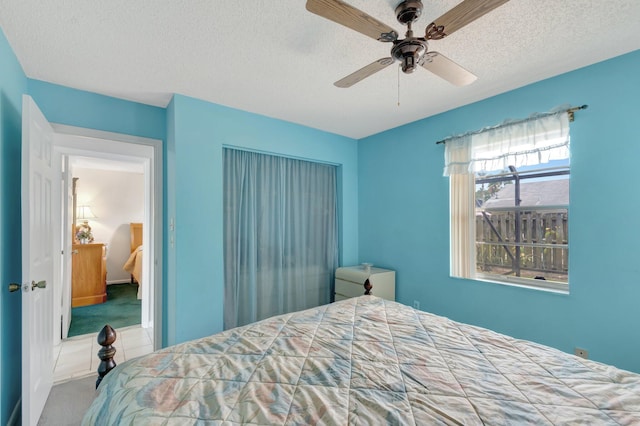 3928 Coelebs Ave, Boynton Beach, FL 33436 - carpeted bedroom with a textured ceiling and a ceiling fan