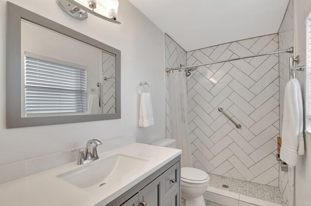 3928 Coelebs Ave, Boynton Beach, FL 33436 - bathroom featuring toilet, vanity, and a tile shower
