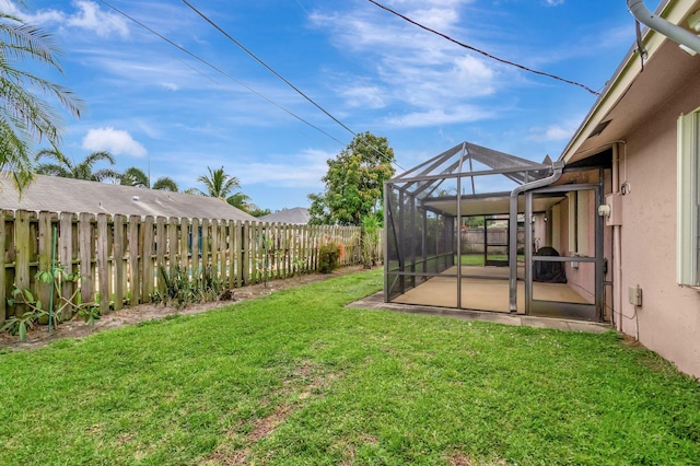 3928 Coelebs Ave, Boynton Beach, FL 33436 - view of yard with a patio and glass enclosure