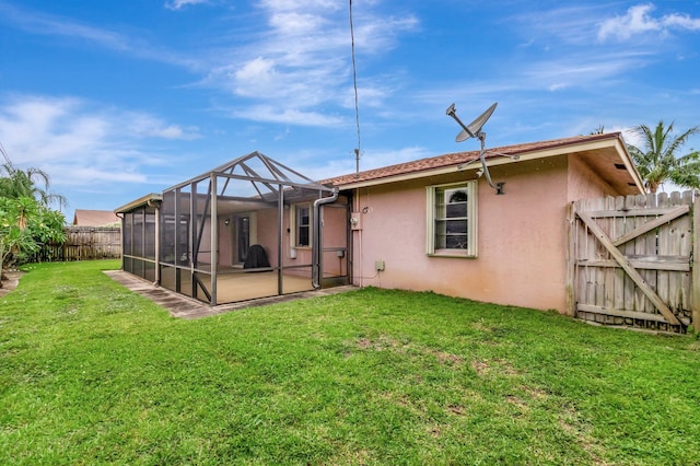 3928 Coelebs Ave, Boynton Beach, FL 33436 - rear view of property featuring stucco siding and a gate