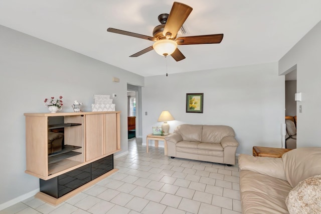 3928 Coelebs Ave, Boynton Beach, FL 33436 - living area with a ceiling fan, light tile patterned floors, and baseboards