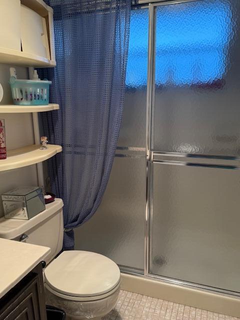 725 Lori Dr Unit 313, Palm Springs, FL 33461 - full bath with a shower with door, vanity, and tile patterned floors