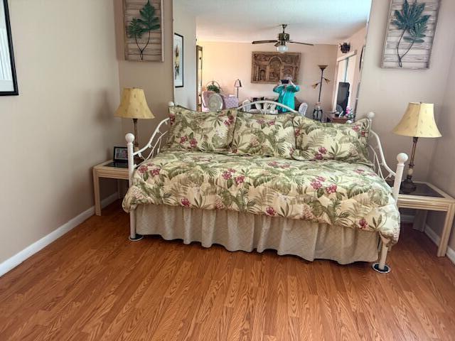 725 Lori Dr Unit 313, Palm Springs, FL 33461 - bedroom featuring wood finished floors and a ceiling fan